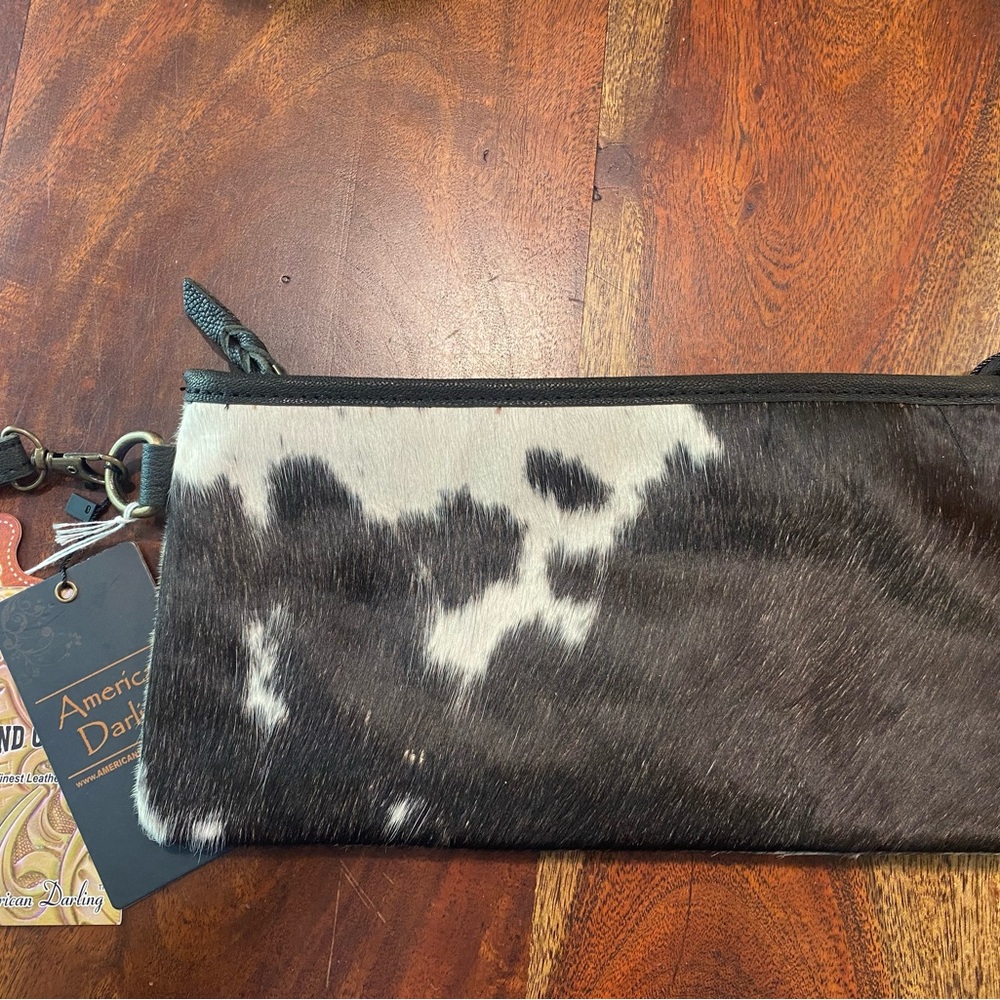 Medium sized clutch.  New with tags.  pd 40 asking 25